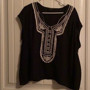 Embroidered pattern on front.